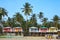 Goa beach Palolem India, colorful bungalows under the palm tree