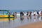 Goa, India, December 10, 2023 - Unidentified tourists enjoying at Arabian sea during the morning time in Calangute beach Goa,