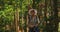 Goa, India. Young Backpacker Tourist Woman Walking And Taking Photos In Tropical Jungle Forest In Sunny Day. Lady