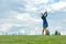 Goal concept, copy space. Women golfing time holding golf equipment on green field background. The pursuit of excellence