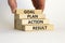 Goal, plan, action, result symbol. Wooden blocks form the words `goal, plan, action, result` on beautiful white background.