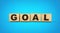 Goal Text On Wooden Blocks Isolated On Blue Background, 3d illustration