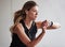 The goal is to beat the clock. a sporty young woman checking her watch while exercising outdoors.