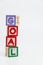 GOAL word wooden block arrange in vertical style on white background and selective focus