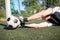 Goalkeeper with ball at football goal on field