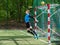 Goalkeeper catches the ball. Stadium goalie sports play ground game, grass soccer keeper man, outdoorsc ompetition,