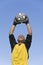 Goalkeeper Catching Soccer Ball Against Blue Sky