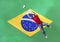 Goalkeeper saving ball in front of Brazilian flag