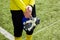 Goalkeeper standing on field with gloves