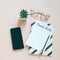 Goals 2020 on flat lay photo of workspace desk with smartphone, card and notebook with copy space background