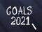 Goals 2021 written in white chalk on a dark surface