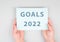 Goals 2022  is standing on a paper, hands are hold in the message