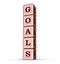 Goals Word Sign. Vertical Stack of Rose Gold Metallic Toy Blocks