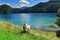 Goat grazing near a mountain lake