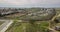 Goatherd walks with herds of goats  through  countryside