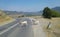 Goats cross the road to pasture in the mountains