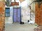 Goats sitting in front of door entrance, Rajshahi, Bangladesh