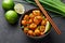 Gobi Manchurian in bowl at black concrete background. Indian Chinese cuisine dish with deep-fried cauliflower