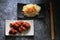 Gochujang ribs and noodles on dark cement background