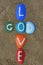 God is love, multicolored stones composition