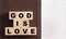 God is Love Spelled in Blocks on a Leather Holy Bible