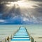 God\'s light is over a pier