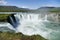 Godafoss waterfall on a glorious day with rainbow, Iceland