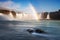 Godafoss waterfall and rainbow on a sunny morning