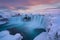 Godafoss waterfall at sunset  Views around Iceland, Northern Europe in winter with snow and ice One of the most powerful waterfall
