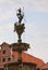 Goddess of the moon. Sculpture in the fountain in front of town hall on cloudy sky background. LÃ¼neburg, Germany