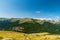 Godeanu and Retazatul Mic mountains from meadow bellow Osleva hill in Valcan mountains in Romania