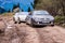 Goderdzi, Georgia - May 8, 2017. Convertible cars going on broken main dirt road in mountains