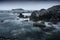 Godrevy lighthouse, waves on the rocks