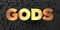 Gods - Gold text on black background - 3D rendered royalty free stock picture