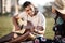 And it goes a little something like this... a young man playing a guitar while on a picnic with his girlfriend.