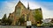 Goes, region of Zeeland, Holland. August 2019. View of three-fourths of the facade of the imposing church of Maria Magdalenakerk.