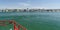 Going on ferry with red guard railing towards South Bayfront of Balboa island