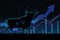 Going high stock market and bullish trend concept with digital bull silhouette on dark background with raising up arrows, graphs