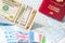 Going to travel. Passport, money, flags of Greece, UK, Italy, France on map. Save money on travel, planning for budget concept.