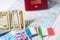 Going to travel. Passport, money, flags of Greece, UK, Italy, France on map. Save money on travel, planning for budget concept.