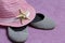 Going on vacation on the beach. Hat for protection from the sun. Beach sneakers and Starfish. Against the background of a beach to