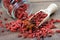 Goji berries in a wooden scoop. dried goji in a glass jar