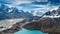 Gokyo Lakes surrounded by rocky hills against high mountain