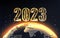 Gold 2023 New Year web banner with gold planet Earth view from space and digits on black background