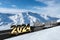Gold 2024 new year car on skateboard and road in mountains winter background