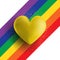 Gold 3D heart on a rainbow striped background