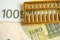 Gold abacus on Euro banknote money, economy finance exchange trade investment concept