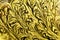 Gold background with shiny flecks in old vintage textured design, elegant fancy crackled foil or yellow plaster wall texture.