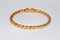 Gold bangle and bracelet on white background