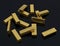 Gold bars in bulk on a black background